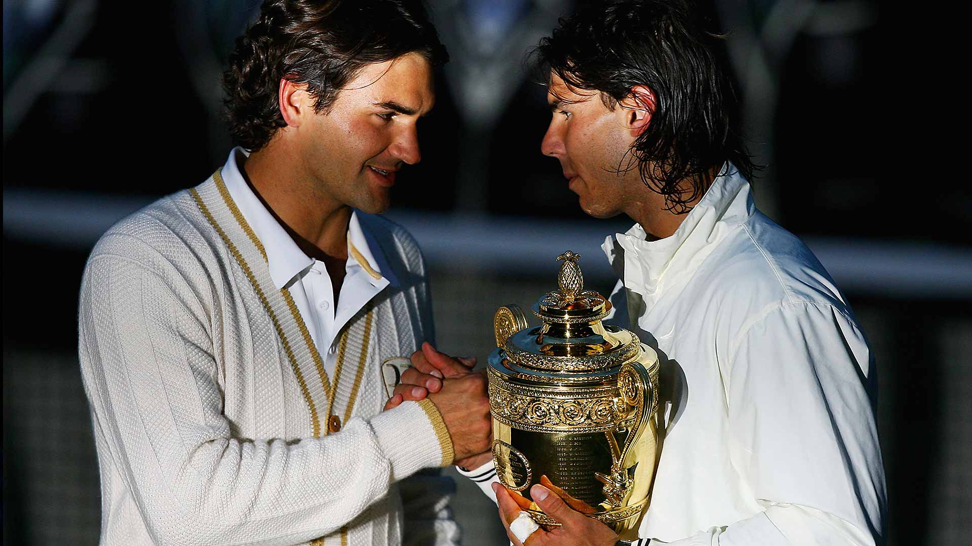 Roger Federer congratulates Rafael Nadal, who prevailed in a 9-7 fifth set in the 2008 Wimbledon final.